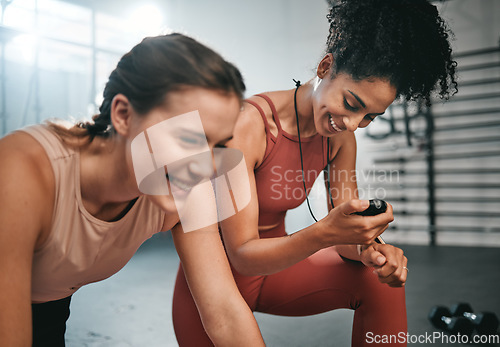 Image of Fitness, smile and girl with a personal trainer for training, exercise time and performance monitor. Motivation, happy and friends helping with a gym workout and reading cardio results on stopwatch