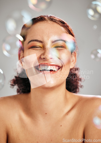Image of Bubbles, happy face and beauty woman in studio for skincare cosmetics, natural skin and dermatology. Facial makeup, health and wellness of comic model person with luxury body product glow and peace