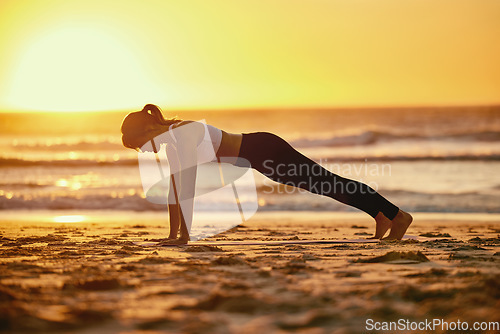 Image of Sunset, beach push up and woman training for health, wellness and fitness. Sports, seashore and female athlete exercising, workout or pushup exercise for strength, muscle energy and power outdoors.