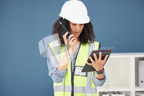 Image of Radio, tablet and construction with a black woman builder talking over a walkie talkie in her office. Building, internet and safety with a female engineer using communication to manage a build site