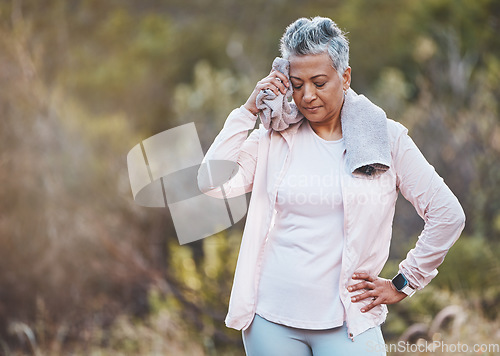 Image of Senior woman, tired and towel for sweating at park after training or workout mock up. Sports fitness, break and fatigue, exhausted and elderly female wipe sweat with fabric after exercise outdoors.