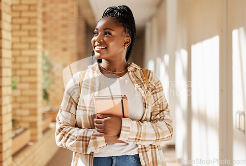 Image of Black woman, college student and thinking about future with books while walking at campus or university. Young gen z female happy about education, learning and choice to study at school building