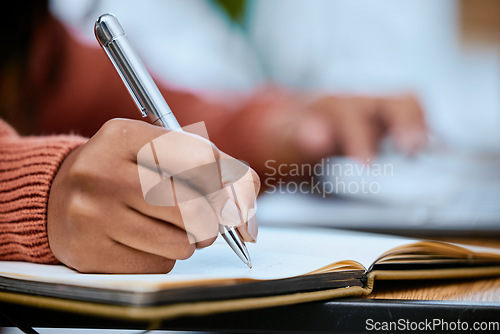 Image of Student, writing and zoom of hand with notebook for studying, learning and notes in academic class. University, college and closeup of hands with pen to write schedule information, planning and ideas