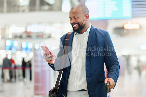Image of Businessman, phone and smile with luggage for travel, journey or texting in communication at the airport. Happy black man, person or employee holding smartphone for chatting, traveling or work trip