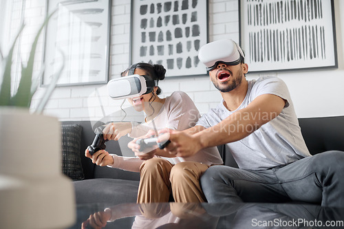 Image of Virtual reality, gaming and metaverse with a couple playing video games in their home together for fun or enjoyment. VR, game and 3d ai with a man and woman gamer bonding in a house living room