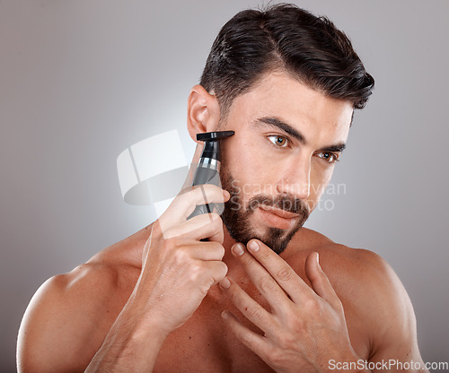 Image of Man, shaving facial beard and razor hair removal, grooming hygiene cleaning or skincare dermatology wellness in grey studio background. Model, face beauty and shave for cosmetics self care cleaning