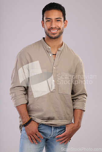 Image of Happy, confident and portrait of a handsome Asian man isolated on a grey background in a studio. Fashion, stylish and young Japanese model in fashionable, cool and attractive clothes on a backdrop