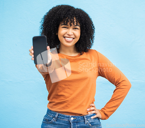 Image of Happy black woman, portrait or phone screen mockup on isolated blue background in social media app or web design. Smile, student or model on technology mock up, city contact communication or branding