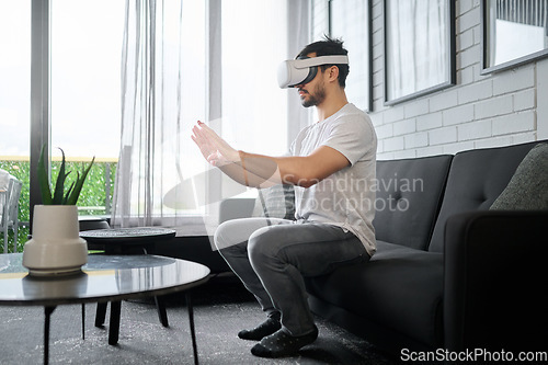 Image of Virtual reality glasses, metaverse and man on sofa with headset for streaming interactive, online and 3d games. Futuristic tech, user interface and male with vr for digital ux, cyberspace and gaming