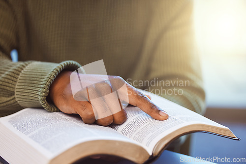 Image of Hands, black man and reading books for knowledge, library and college education exam. Closeup finger on paper textbook for learning, studying and story for research project, analysis and information