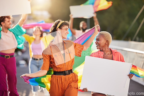 Image of People, protest and march for LGBTQ with pride for gay, lesbian or bisexual sexuality together in the city. Happy group of homosexual women and men walking in street with billboards and rainbow flags