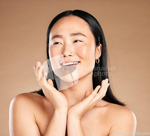 Image of Beauty, skincare or happy Japanese woman cleaning face in grooming routine isolated on studio background. Tokyo, relaxed or beautiful Asian girl model smiles in luxury facial treatment with self care