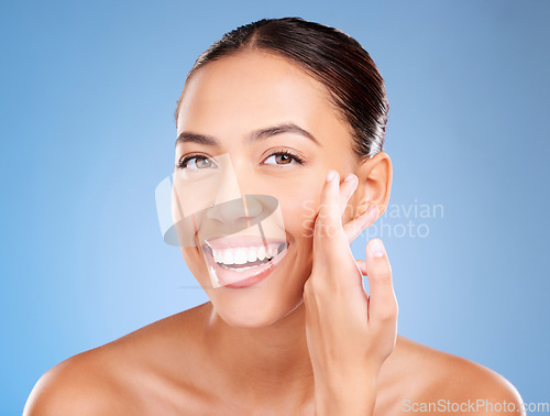 Image of Face portrait, beauty skincare and woman in studio isolated on a blue background. Makeup, cosmetics and young female model with healthy, glowing and flawless skin after luxury spa facial treatment.