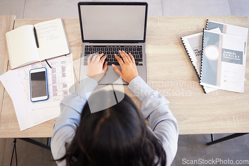 Image of Top view, laptop and business woman typing email, report or proposal in office workplace mock up. Computer, research and female employee planning sales, advertising or marketing strategy in company.