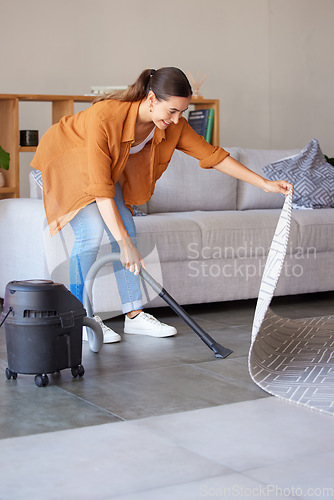 Image of Cleaning, housekeeping and woman vacuum cleaner for floor in living room for dirt, dust and hygiene in home. Cleaning service, domestic housework and girl with electric appliance for lounge flooring