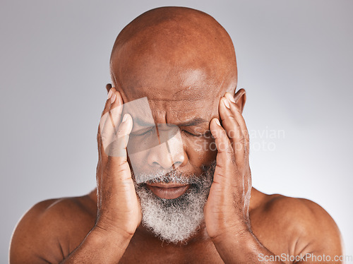 Image of Elderly black man, headache and pain with hands and face, stress and mental health against studio background. Depression, skin and senior with healthcare problem, retirement and anxiety migraine