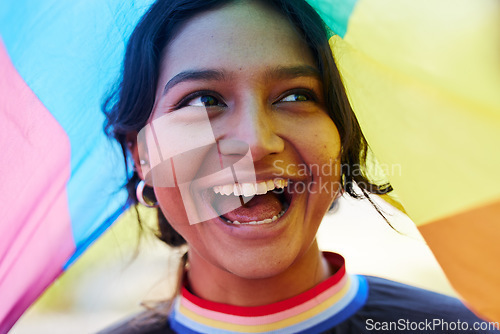 Image of Rainbow, flag and lgbt with an indian woman in celebration of gay pride or human rights alone outdoor. Freedom, equality and lgbtq with a happy female outside celebrating her equality or inclusion