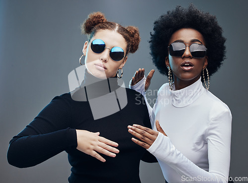Image of Fashion, women with sunglasses and futuristic with robotics, cyberpunk and trendy. Future design, females or girls with eyewear, gen z and marketing for tech development, fantasy or studio background
