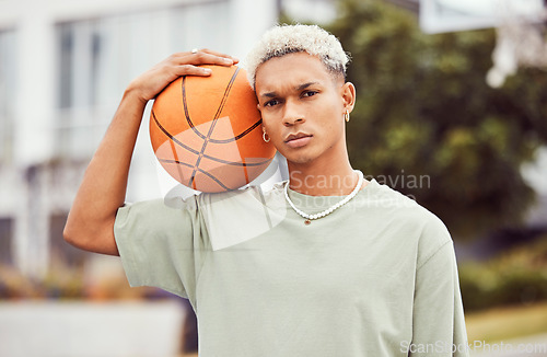 Image of Basketball, young man and basketball player with sport in park with portrait in city and exercise outdoor. Fitness, athlete on basketball court, focus and urban with sports motivation and training.