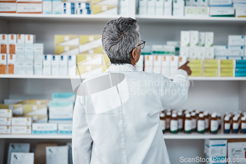 Image of Pharmacy pills, pointing and senior pharmacist with product choice, medicine box or pharmaceutical medication drugs. Retail medical store, healthcare and back of elderly woman point at shop shelf