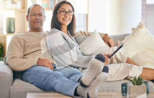 Image of Mature couple, tablet and relax portrait on sofa together for love, support and romance bonding in living room at home. Man smile, happy woman, and romantic quality time on couch with tech device