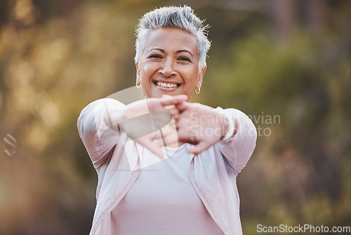 Image of Fitness, portrait or old woman stretching in nature to start training, hiking exercise or workout in a park in Portugal. Happy, warm up or healthy senior person smiles with pride, goals or motivation