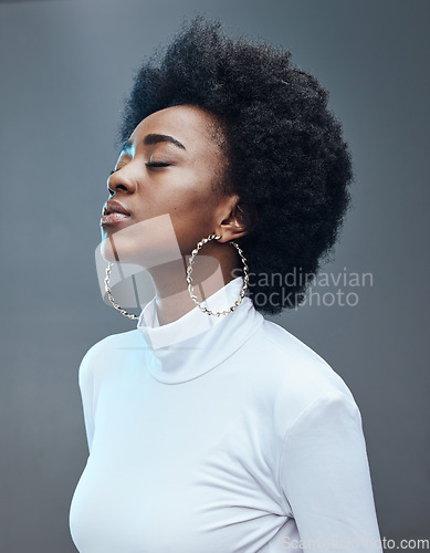 Image of Calm, relax and black woman with peace and a positive mindset in a studio for mindfulness and balance. Relaxing, breathe and African female model with mental wellness isolated by a gray background.