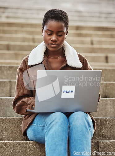 Image of Education, black woman on stairs and laptop for college, online learning and focus outdoor. Nigerian female student, girl on steps and academic with pc, search internet and website reading for exams