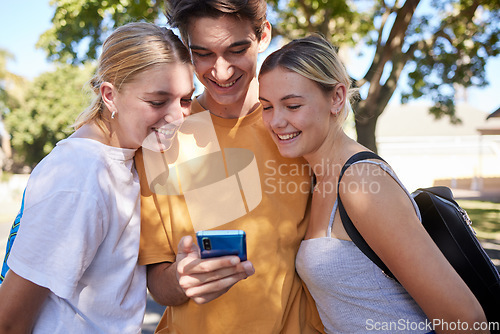 Image of Phone, friends and social media in a park with a man and woman group reading a text message together outdoor. Mobile 5g technology, communication and friendship with college or university students