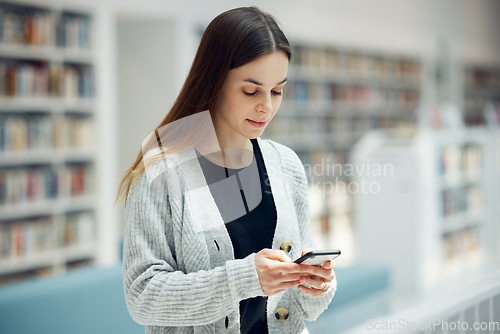 Image of Smartphone, bookstore and woman typing a text message, reading blog or doing research on internet. Books, library and young student networking on social media or mobile app on cellphone at university