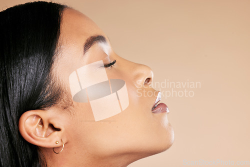 Image of Makeup, beauty and face of a woman with mockup for skincare isolated on a studio background. Spa, dermatology and side profile facial cosmetics of a woman with cosmetology on a backdrop with space