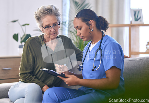 Image of Healthcare, retirement and documents with a nurse and woman in consultation over treatment in a home. Medical, insurance and clipboard with a female medicine professional taking to a mature patient