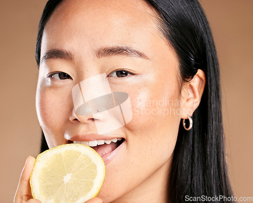 Image of Asian woman, studio portrait and lemon for smile, healthy cosmetic glow on skin health by background. Japanese model, girl and beauty for vitamin c fruit, natural aesthetic or cosmetics for self love