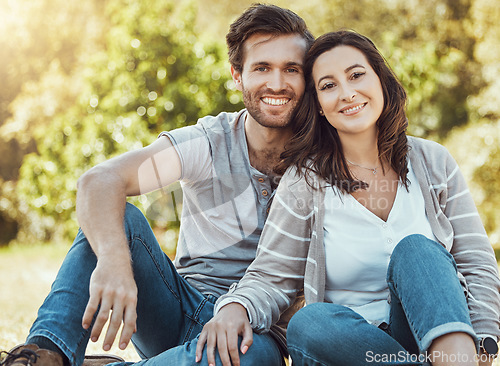 Image of Couple, park and portrait of young people with love, care and bonding together in nature. Lens flare, smile and happy woman and man in sunshine feeling happiness from engagement and commitment