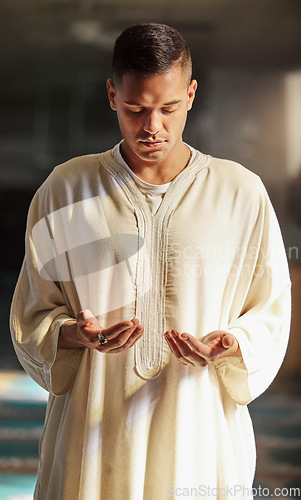 Image of Man, muslim faith and praying in mosque for God, peace and mindfulness with traditional islamic clothes. Islam worship, prayer and spiritual balance for ramadan, religion and gratitude in Doha, Qatar