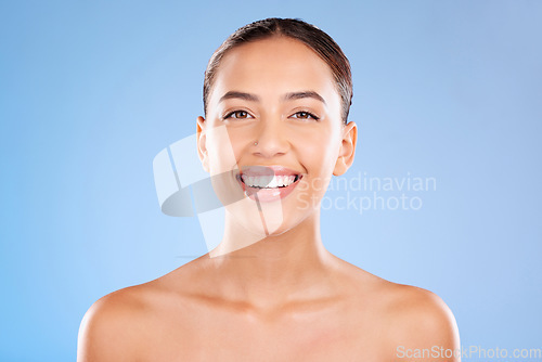 Image of Face portrait, beauty skincare and woman in studio isolated on a blue background. Makeup, cosmetics and young female model with healthy, glowing and flawless skin after luxury spa facial treatment.