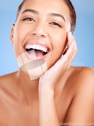 Image of Face portrait, beauty skincare and woman in studio isolated on a blue background. Makeup, cosmetics and young female model with healthy, glowing and flawless skin after luxury spa facial treatment.