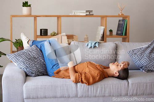 Image of Tired cleaner woman, sleep and sofa to relax for fatigue, wellness and mental health after cleaning house. Hygiene expert, burnout and sleeping on living room couch for rest, health or stress in home