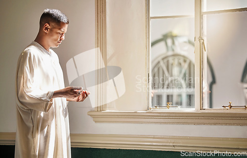 Image of Muslim, prayer or man in a mosque praying to Allah for spiritual mindfulness, support or wellness in Doha, Qatar. Religion, peace or Islamic person in temple to worship or praise God with gratitude