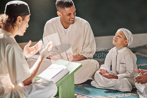 Image of Muslim child, mosque and quran with teacher for spiritual learning, development or growth on carpet. Islamic teaching, man and boy for holy worship, book or reading for faith, islam or study in Qatar