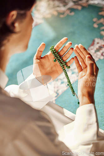 Image of Praying, worship and hands of a man in a mosque for hope, faith and holy support during Ramadan. Prayer, gratitude and Islamic person with trust in God, spiritual and respect for Arabic religion