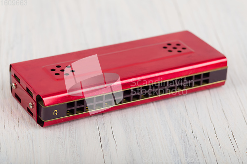 Image of Harmonica on a wooden table