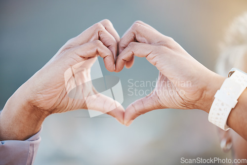 Image of Hands, heart sign and senior woman in nature for healthy workout, exercise or training outdoors. Sports, fitness and retired female with gesture for love emoji, affection or romance, support and care