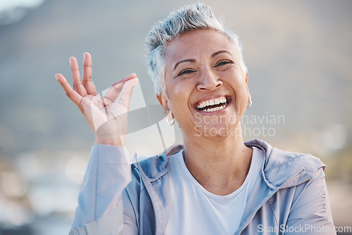 Image of OK hand, fitness senior woman and nature portrait for exercise, wellness or workout success, trust and healthy elderly promotion. Yes sign, happy and retirement woman for sports or wellness journey