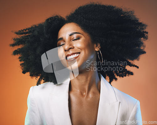 Image of Black woman, beauty and hair with hair care and happy with afro, makeup with cosmetic care, face and skincare. Dance, freedom with facial and natural curly hair texture against studio background