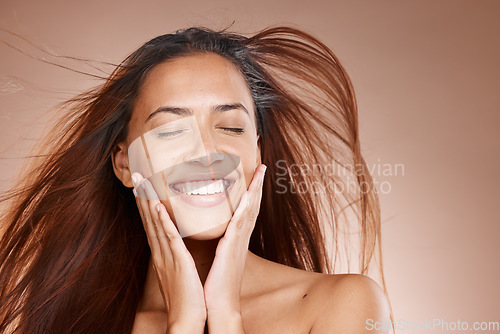 Image of Face, beauty skincare and woman with eyes closed in studio on a brown background mockup. Hands, makeup cosmetics and happy female model satisfied with spa facial treatment for healthy or glowing skin