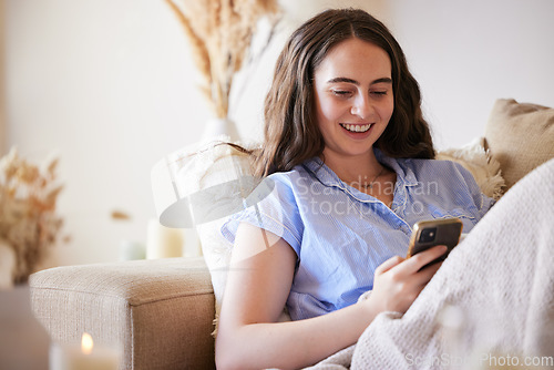 Image of Phone, sofa and relax woman typing post to social media app, online blog or doing internet web search. Peace, networking communication and gen z girl reading meme, news or contact social network user