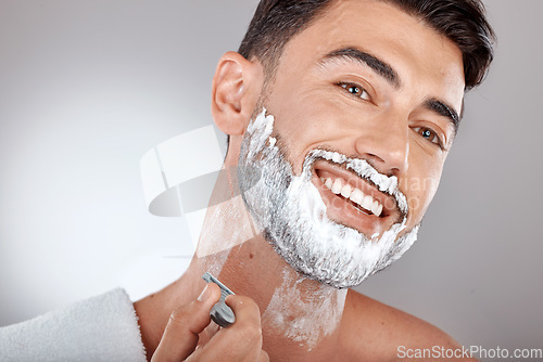 Image of Grooming, foam and shaving with face of man with razor for beauty, hygiene and skincare with morning routine. Self care, facial and shave beard with model and cream product for wellness and cleaning