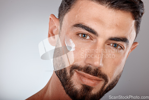 Image of Man, face and cream for skincare and beauty zoom with sunscreen, facial portrait and moisturizer. Lotion, skin wellness and glow with treatment, cosmetic care mockup against studio background