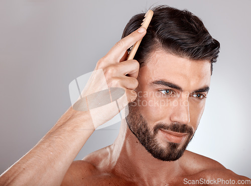 Image of Comb, beauty or man brushing hair for grooming advertising or marketing salon hair care products. Thinking, studio background or healthy male model with cool hairstyle in morning routine treatment